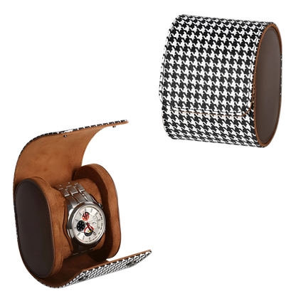 Watch with a houndstooth patterned and brown leather display stand on a white background
