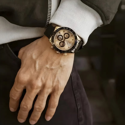 Close-up of a hand wearing a luxurious watch with a blurred background