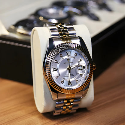 Luxury watch with gold and silver band on a wooden surface