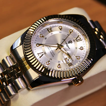 Gold wristwatch with a silver face on a wooden surface