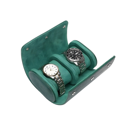 Two watches in a green watch case on a white background