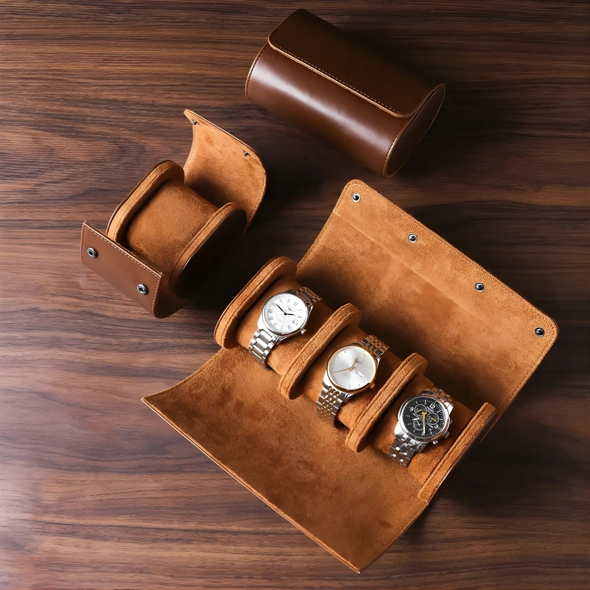 Brown leather watch case with four watches on a wooden surface